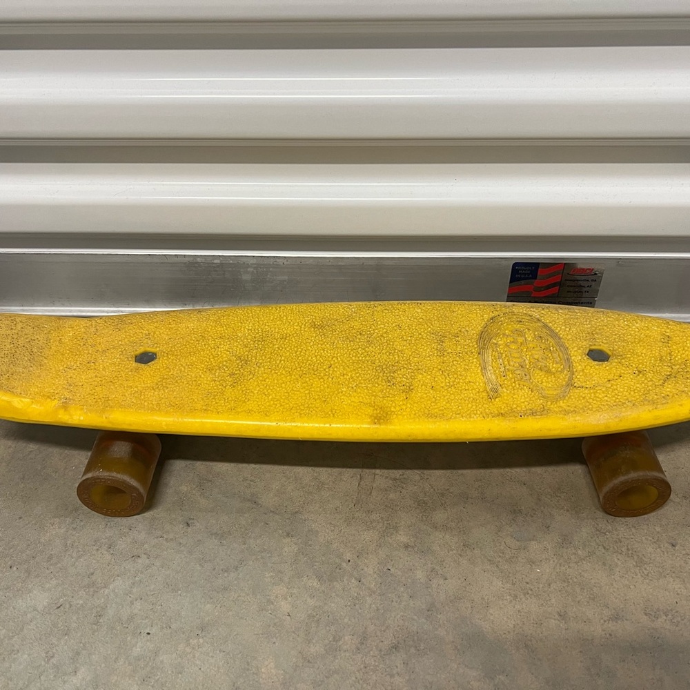 Yellow Skateboard with Brown Wheels